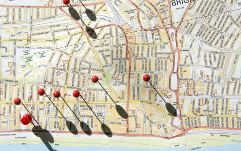 Map of Brighton, with red pins casting oblique shadows